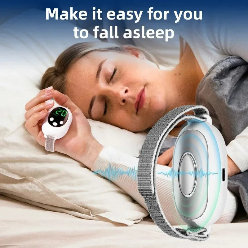 White wireless sleep aid bracelet with handheld remote control on a surface