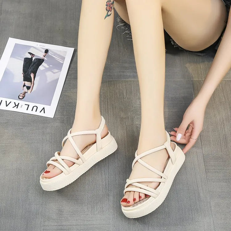 Women's black Roman platform sandals with a round toe strap and textured TPR sole.