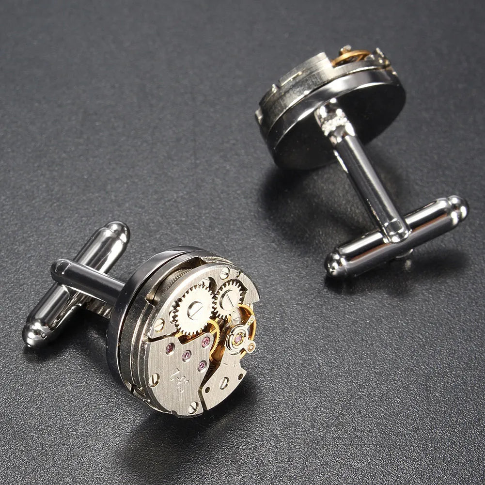 Silver geometric men's cufflinks with copper body and mechanical watch movement on dress shirt cuff