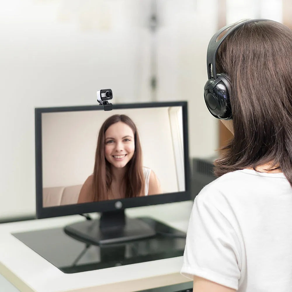 Mini driverless USB webcam with rotating lens in blue, red, or white colours.