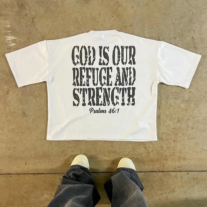 A man's printed short-sleeve cotton T-shirt in a retro street style with a drop-shoulder design.