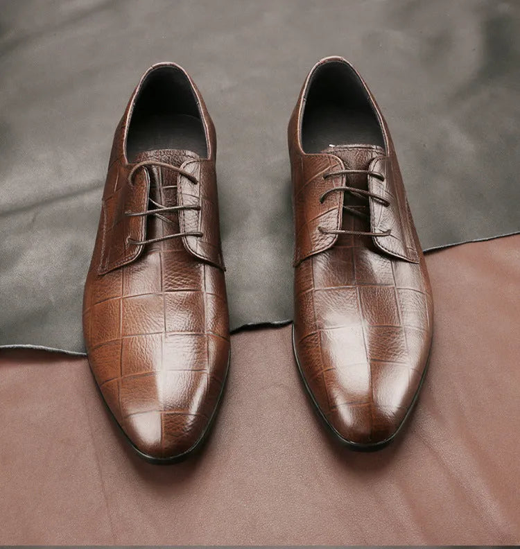 Men's black leather derby shoes with a checkered pattern on the pointed toe.