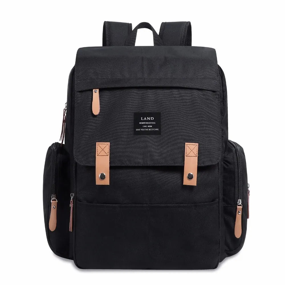 Land Mommy large oxford cloth diaper backpack in grey with a changing mat, shown open.