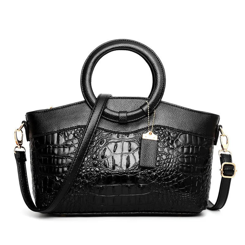 Ladies fashion handbag in multiple colours showing zipper compartments and shoulder strap
