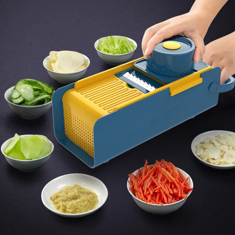Hand-push vegetable grater with 4 stainless steel blades and hand guard on countertop