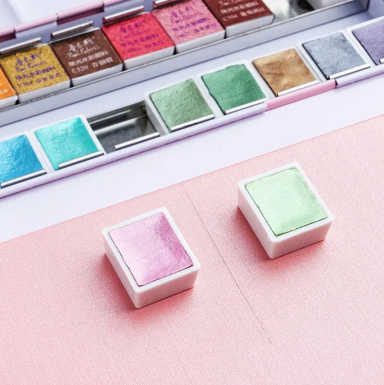 Solid watercolour paint palette with pearl finish pans, shown in 12-colour and 24-colour set options.