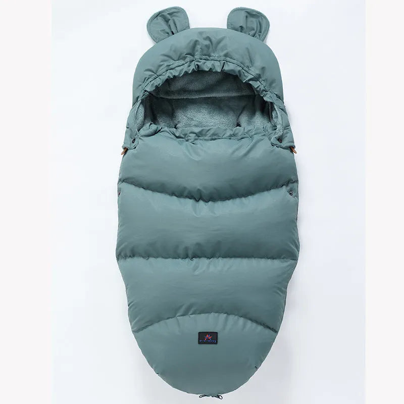 Convertible baby sleeping bag cocoon in a pram, showing cotton blend fabric and flannel lining.
