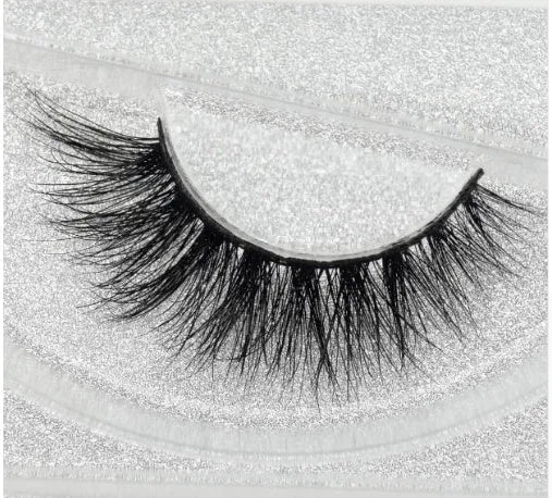 Pair of faux mink eyelashes with long tail and cotton stem against white background