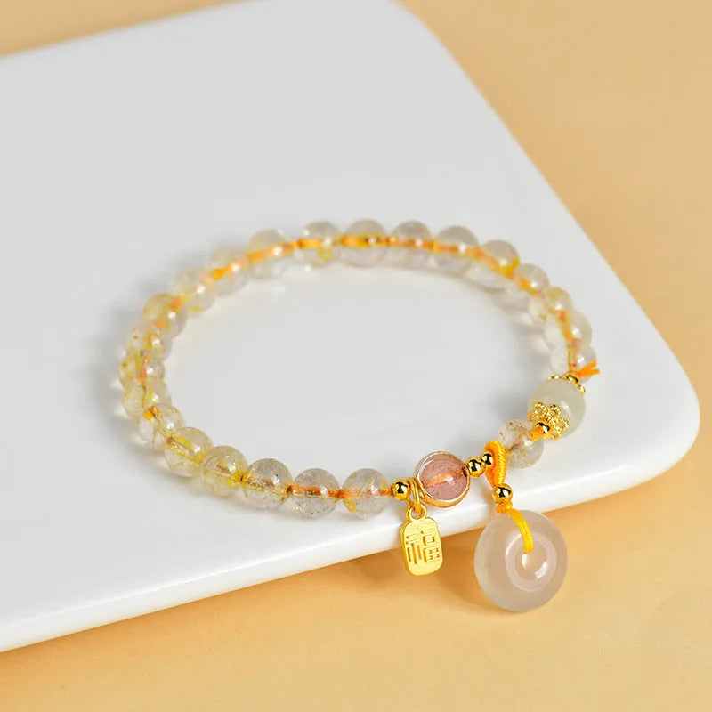 Gold rutilated quartz crystal bracelet with safety buckle and geometric pendant in national style design