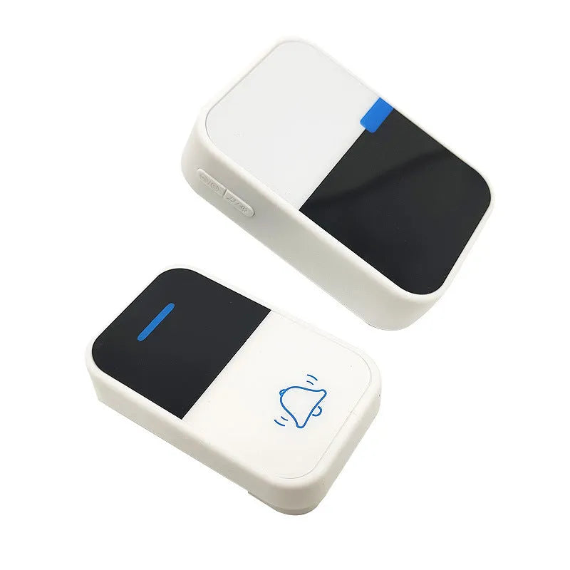 Modern white plastic wireless doorbell receiver and self-generating button unit.