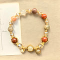 Gold citrine bracelet with hand-woven 8mm beads featuring Chinese auspicious charms