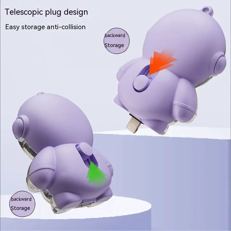 Small keychain emergency power bank in orange plastic shell with cartoon-style design and keyring attachment