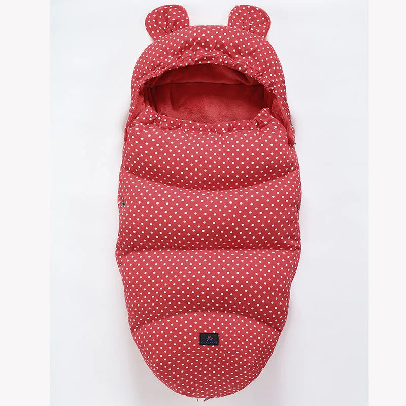 Convertible baby sleeping bag cocoon in a pram, showing cotton blend fabric and flannel lining.