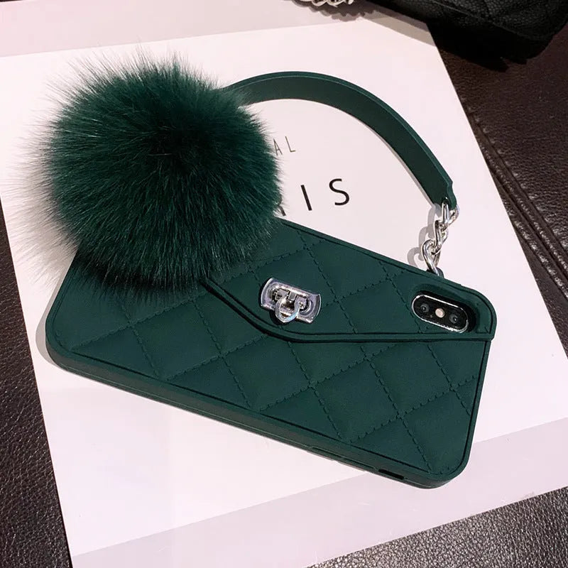 Soft plush hairball texture iPhone back cover case in a dark green grid pattern on a table