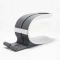 Grey desktop charging stand holding iPhone and Apple Watch