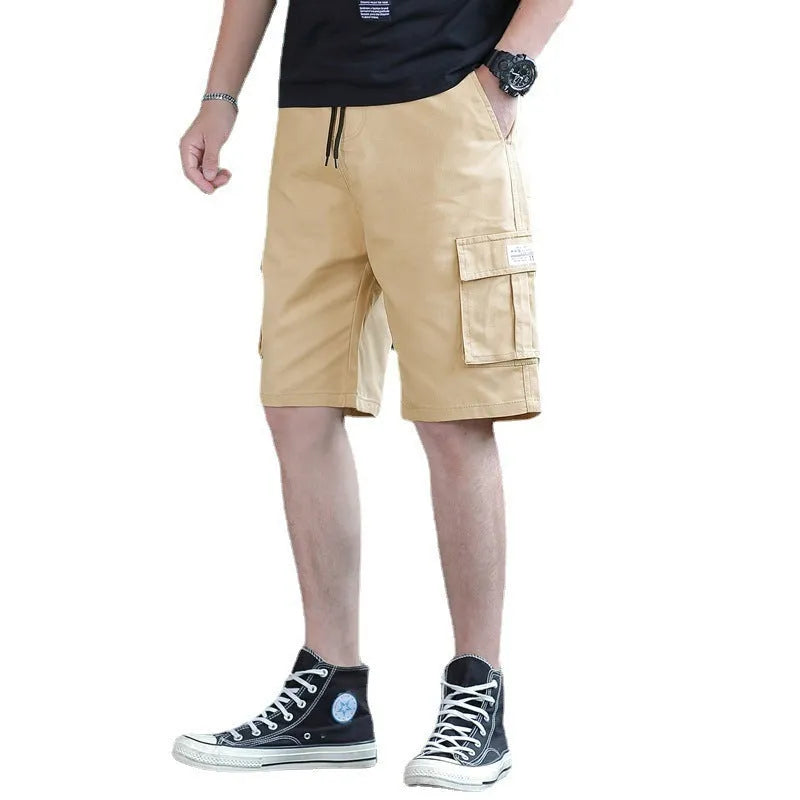 Man wearing loose-fit khaki casual trousers, showing the Korean style and thin fabric texture.