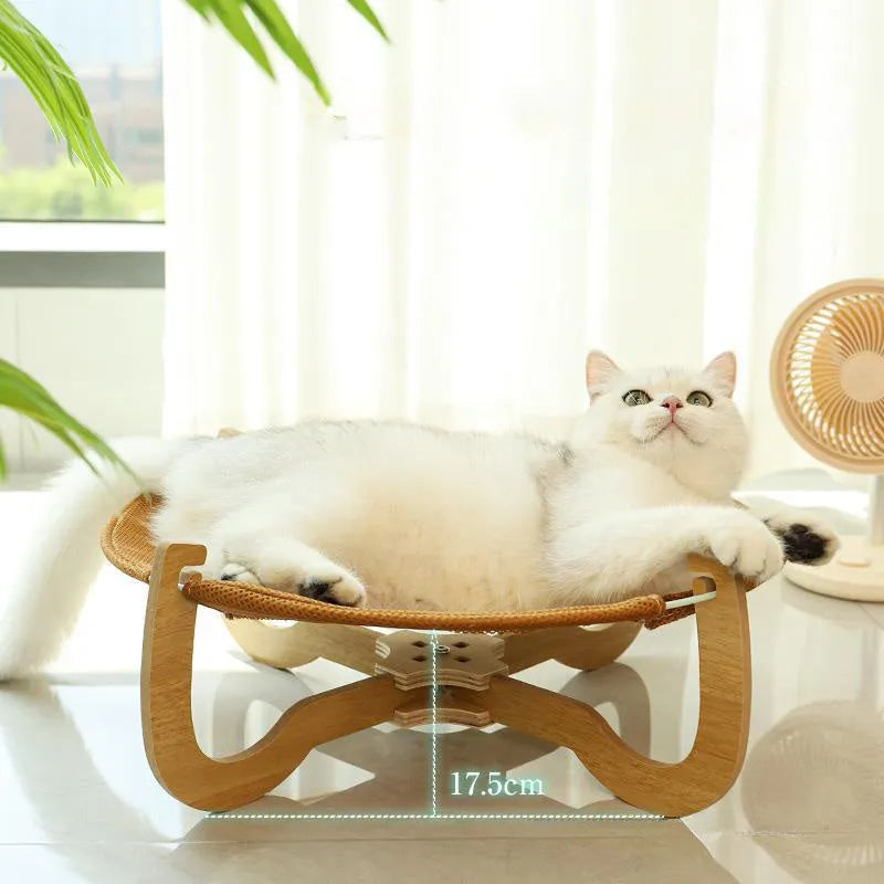 Brown woven rattan off-ground hammock bed for cats and small dogs.