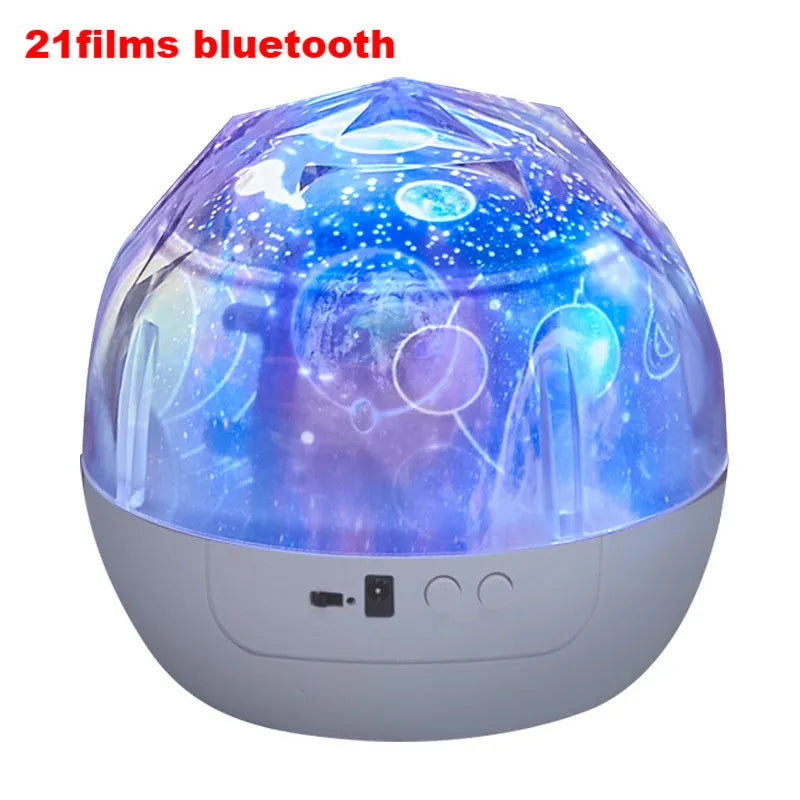 Compact plastic starry sky projector showing cosmic projection on a wall with USB cable.