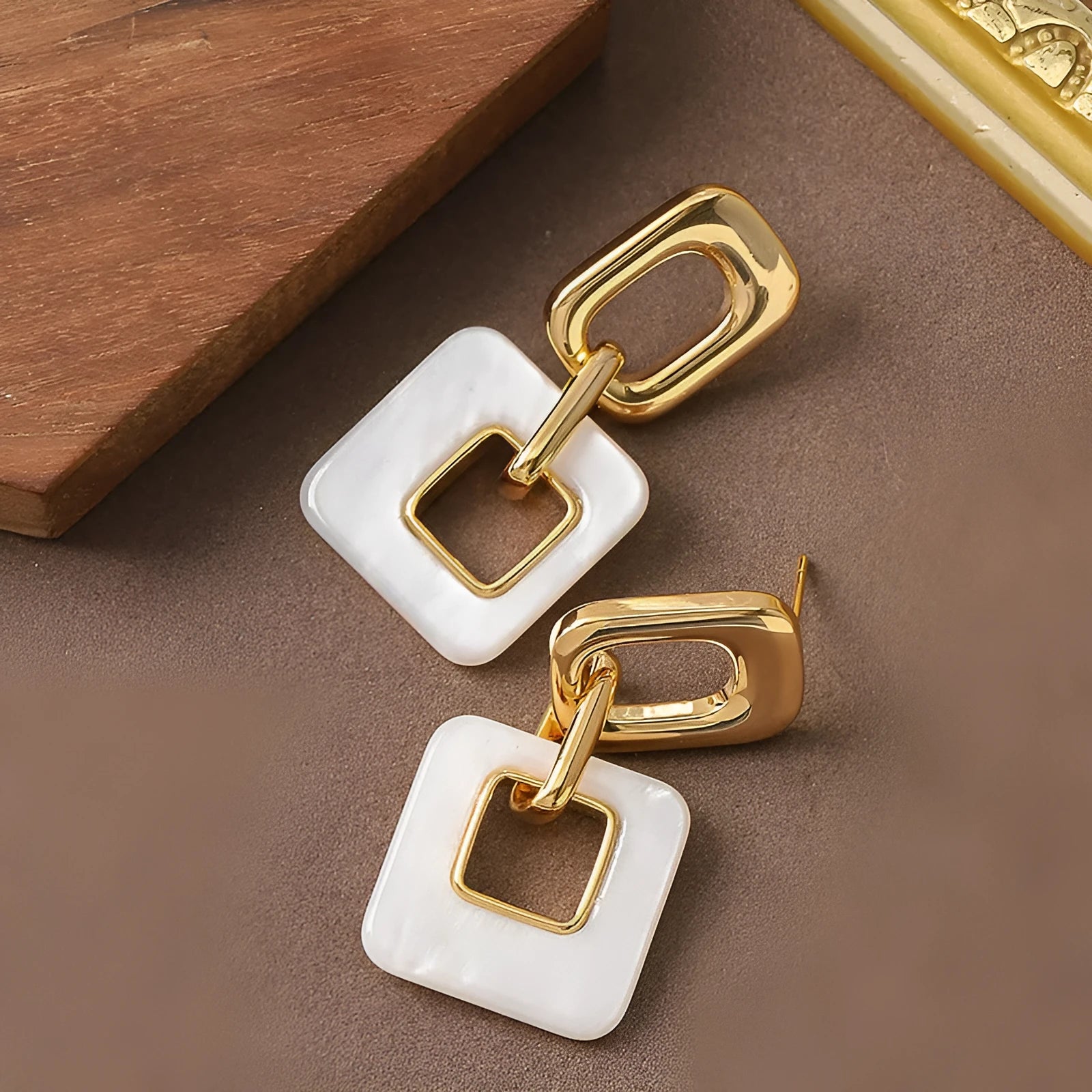 Hollow geometric square earrings with chamfered pattern in electroplated copper
