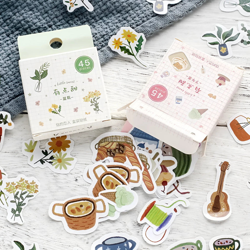 Boxed pack of 45 cartoon paper stickers with 15 patterns in 43x43mm size, featuring cute fruit designs
