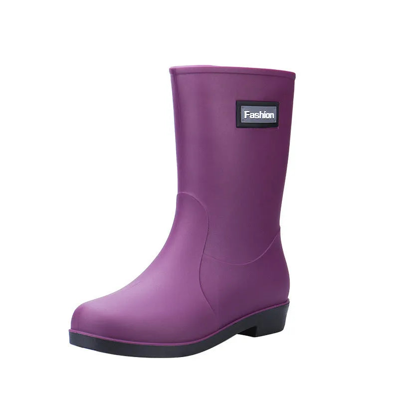 Women's mid-calf PVC rain boots in apricot colour with a low heel for wet weather.