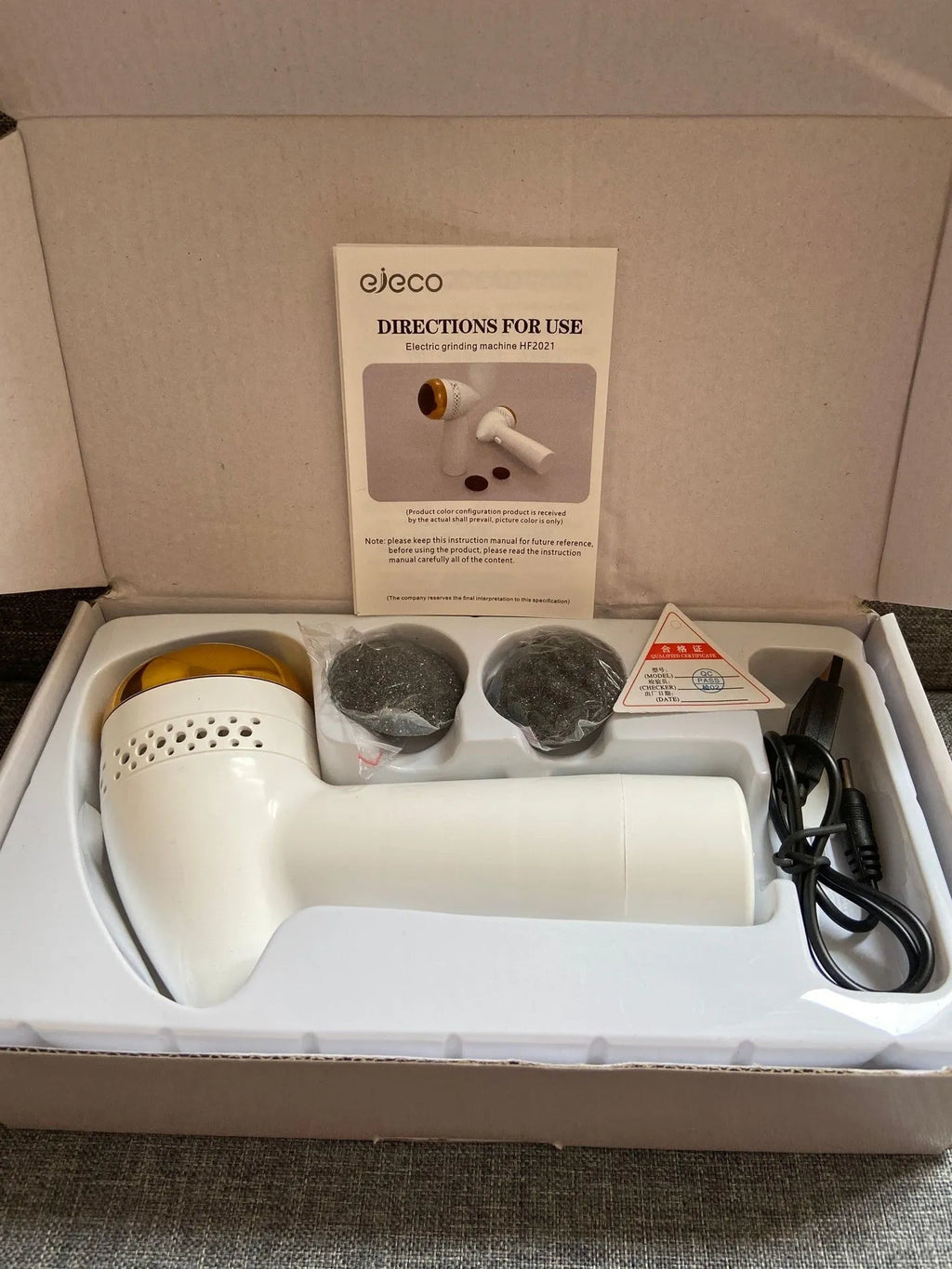 Electric vacuum foot grinder with refined quartz head in gold finish for gentle cuticle removal
