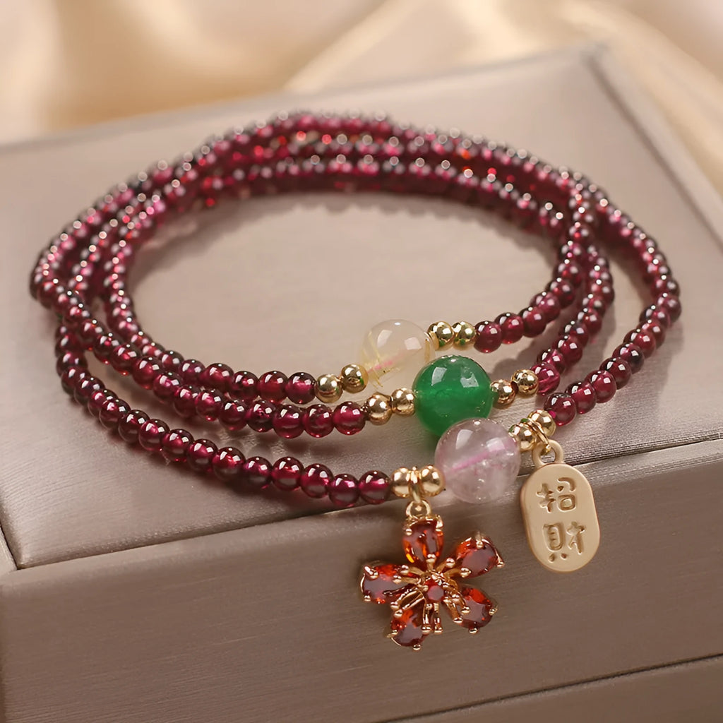 Women's crystal pomegranate bracelet with red cherry blossom beads and sequin detailing