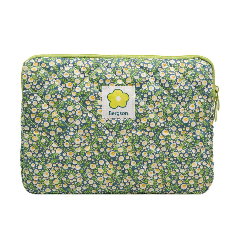 South Korean Ins cotton tablet handbag in green flower pattern with zipper closure on a table