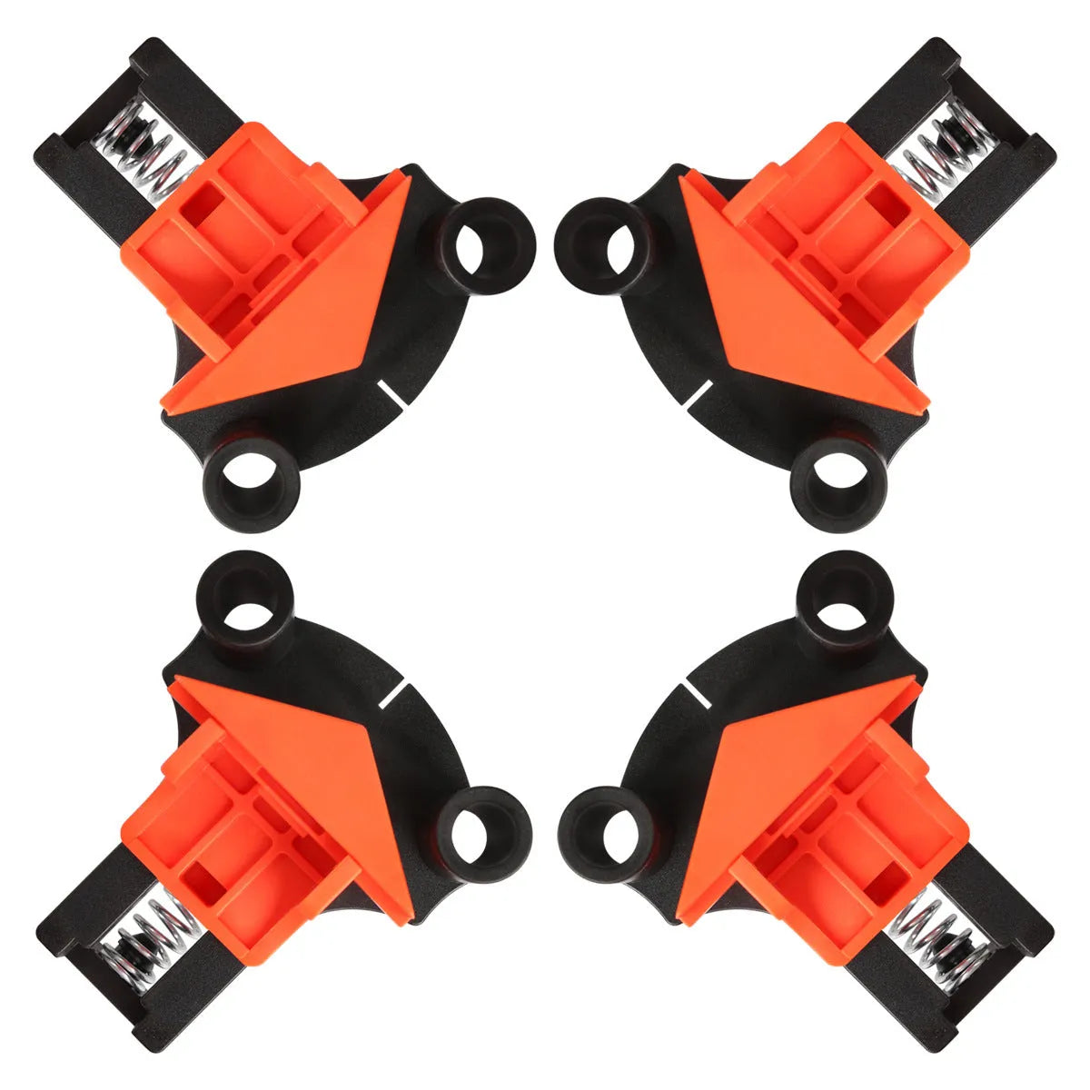 Set of four white plastic right angle clamps for picture frame assembly on a wooden surface.