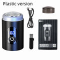 Black mini portable electric shaver with USB charging cable and cleaning brush.