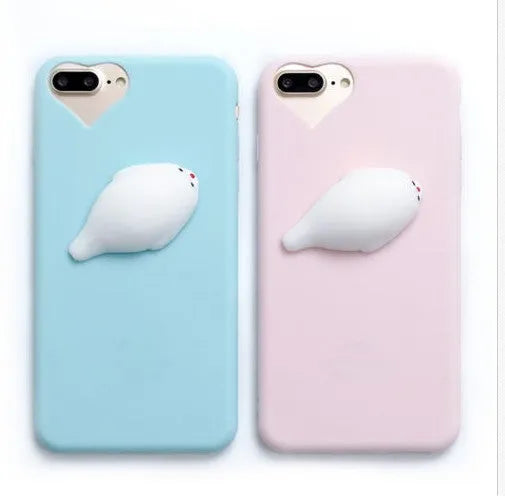 Soft pink silicone iPhone case with a 3D cartoon cat design on the back.