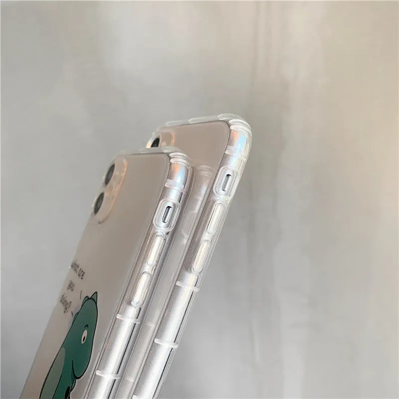 Transparent iPhone case with dinosaur design showing green dinosaur pattern on back