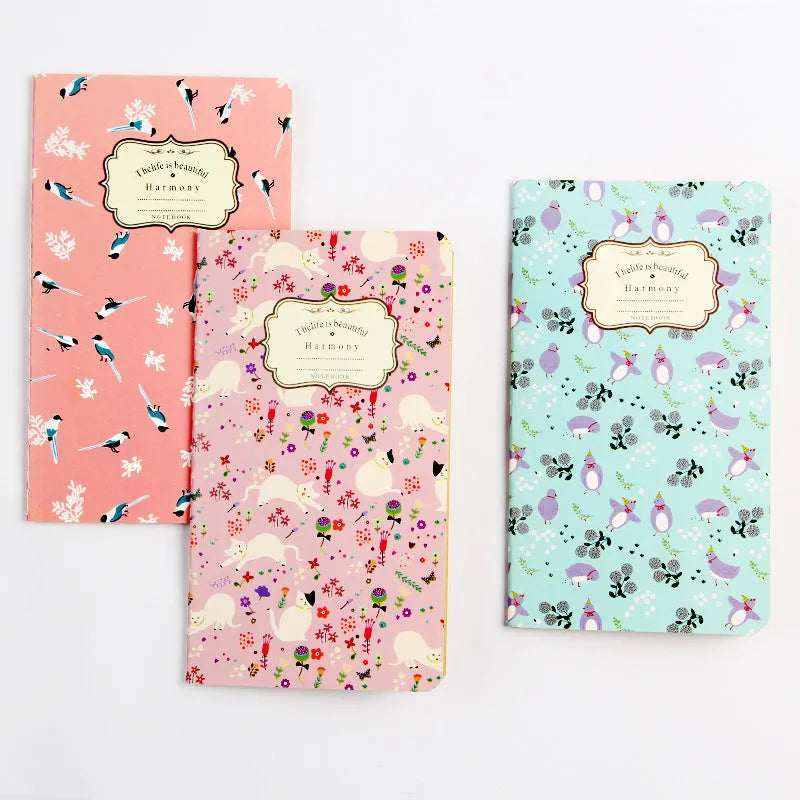 Hand-stitched kraft paper notebook with tassel bookmark on blank pages.