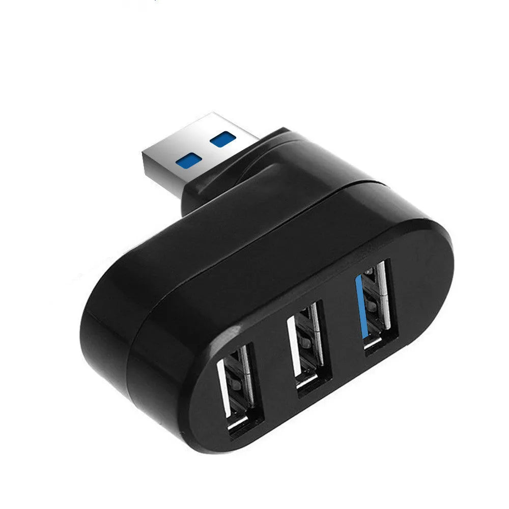 Black USB rotary splitter hub with four USB ports on a white desktop