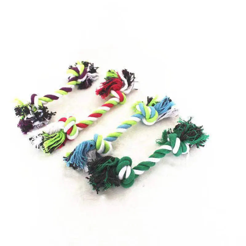 Double knot cotton rope dog toy on neutral background showing two rope knots and loose ends