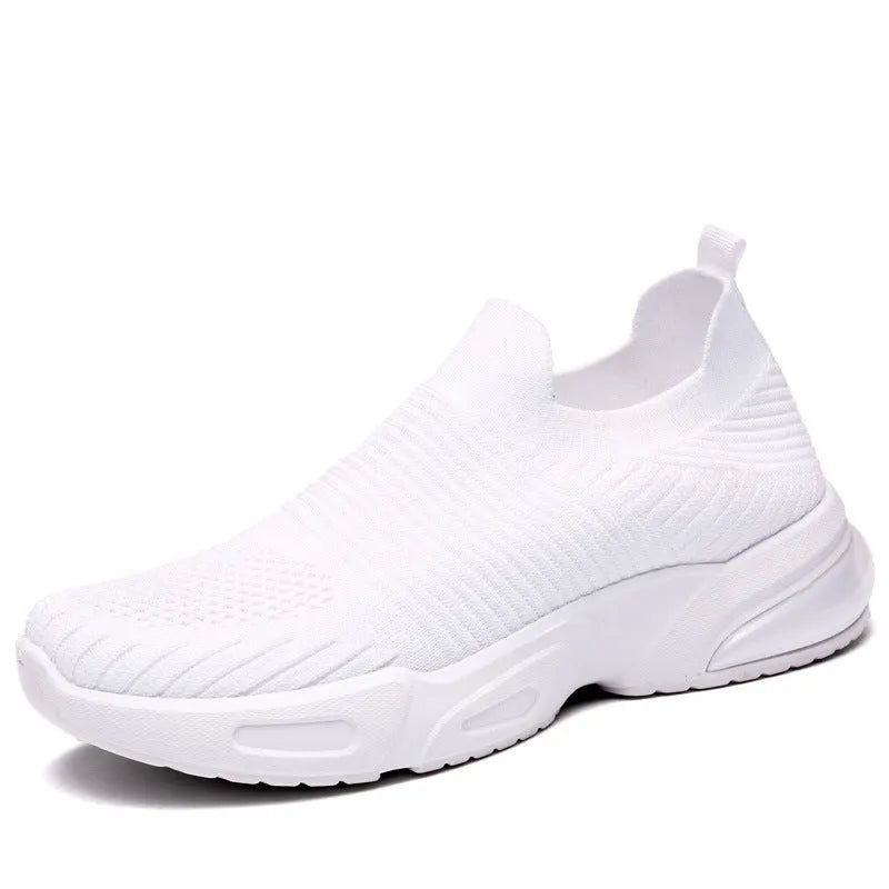 A pair of low-top slip-on sock shoes with a mesh upper and PVC sole on a plain background.