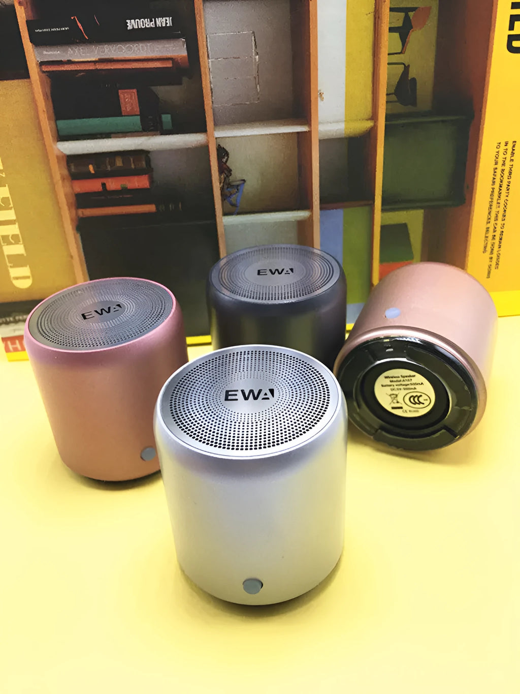 Mini wireless Bluetooth speaker in grey with compact body, 600mAh battery, and 10m Bluetooth range