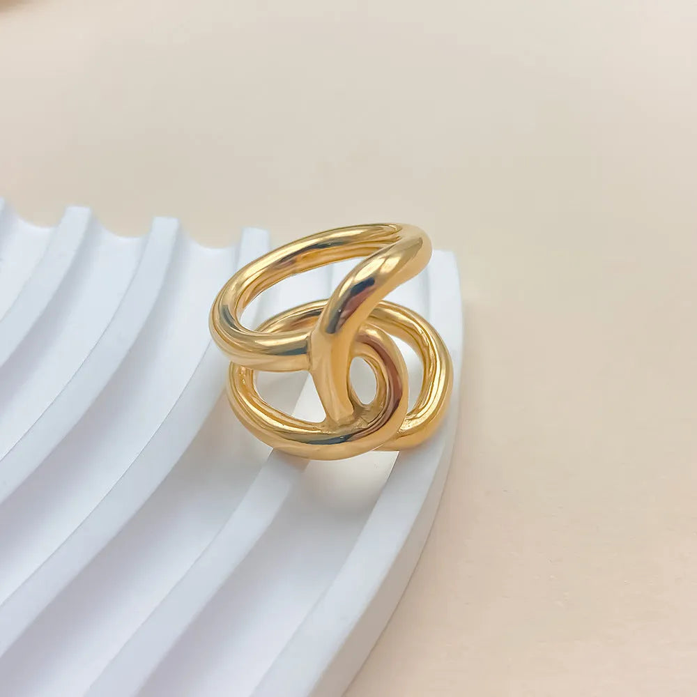 Women's adjustable knotted geometric ring in stainless steel showing U-shape opening design