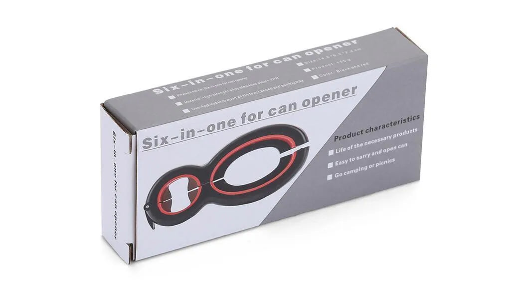 Six-in-one can opener in grey, ergonomic handle with stainless steel parts, on a kitchen counter