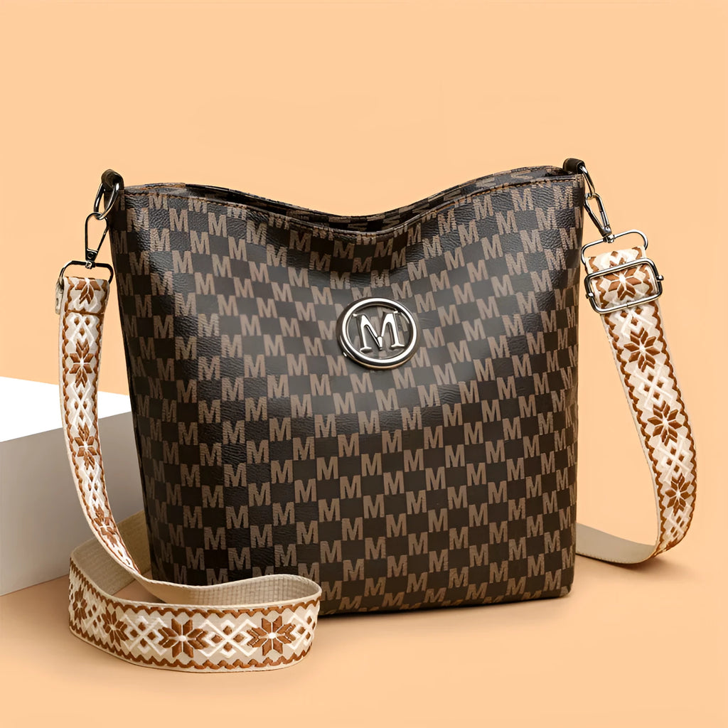PU dumpling shape shoulder bag in black showing structured design with sandwich pocket