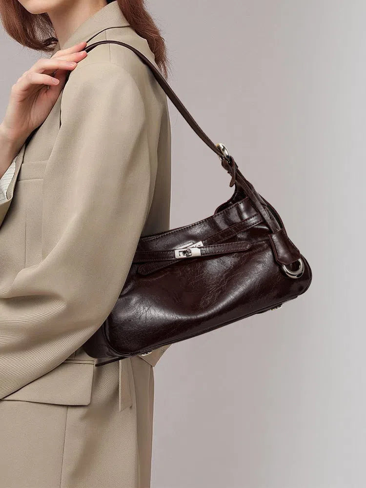 Genuine leather horizontal square crossbody bag with stitching and inner zippered compartment in brown