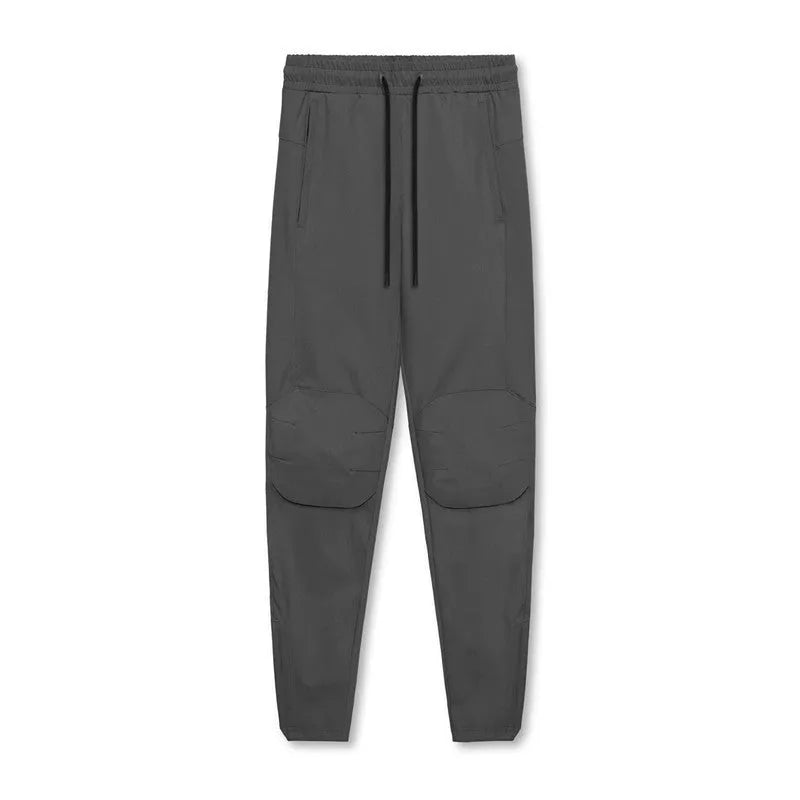 Men's loose grey running pants with ankle ties, quick-drying polyester fitness trousers for exercise