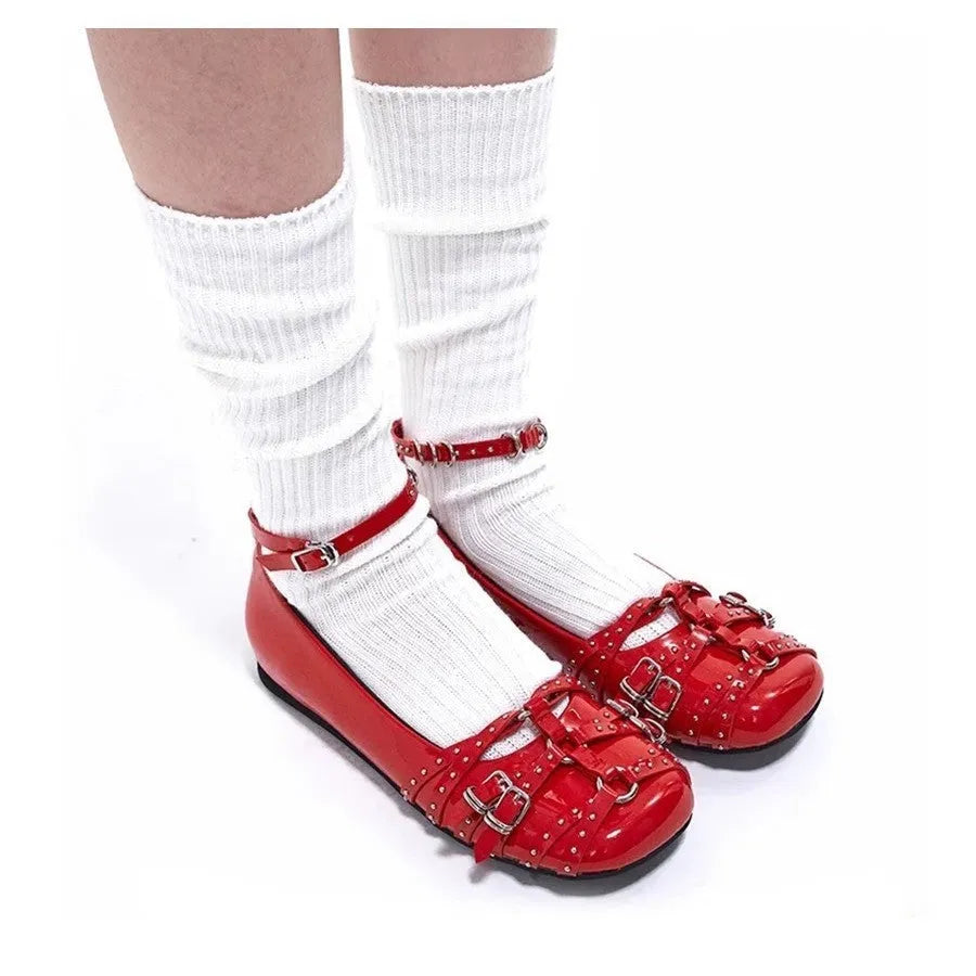 Women's black patent leather flat shoes with buckle closure and square toe