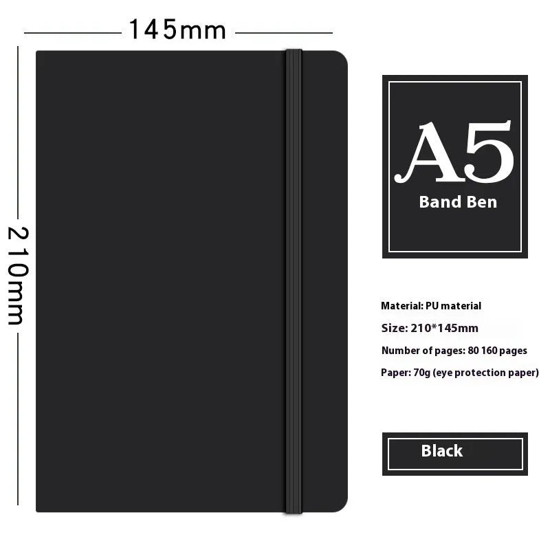 A5 faux leather notebook with pen insert and strap, open on a desk showing lined pages