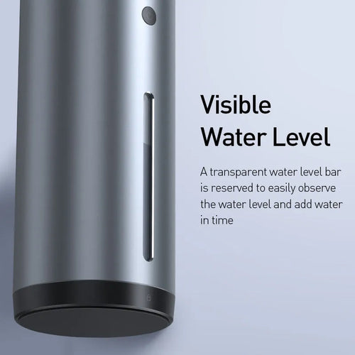 Black aluminium car humidifier and air purifier unit with USB cable on a car dashboard.