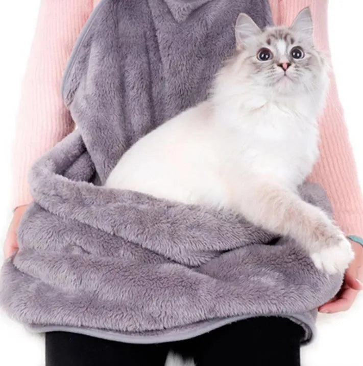 Grey pet out cat carrying bag with sleeping chest apron on a neutral background