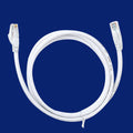 White Cat6 network cable with RJ-45 connectors on both ends lying on a flat surface