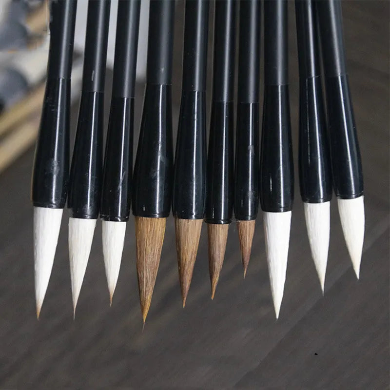 Student writing brush with steel barrel and traditional brush head, 23cm long