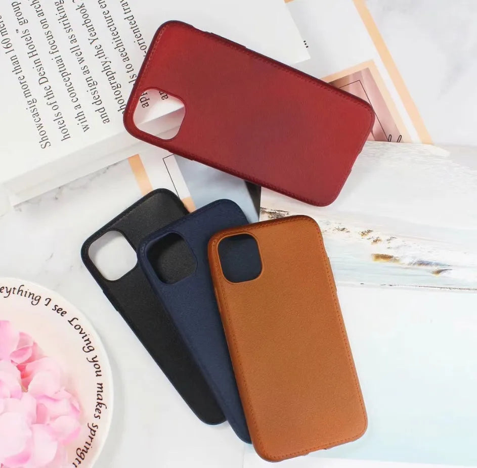 Genuine leather iPhone case with TPU bumper in Black, Brown, Navy Blue, and Wine Red colours for multiple models.