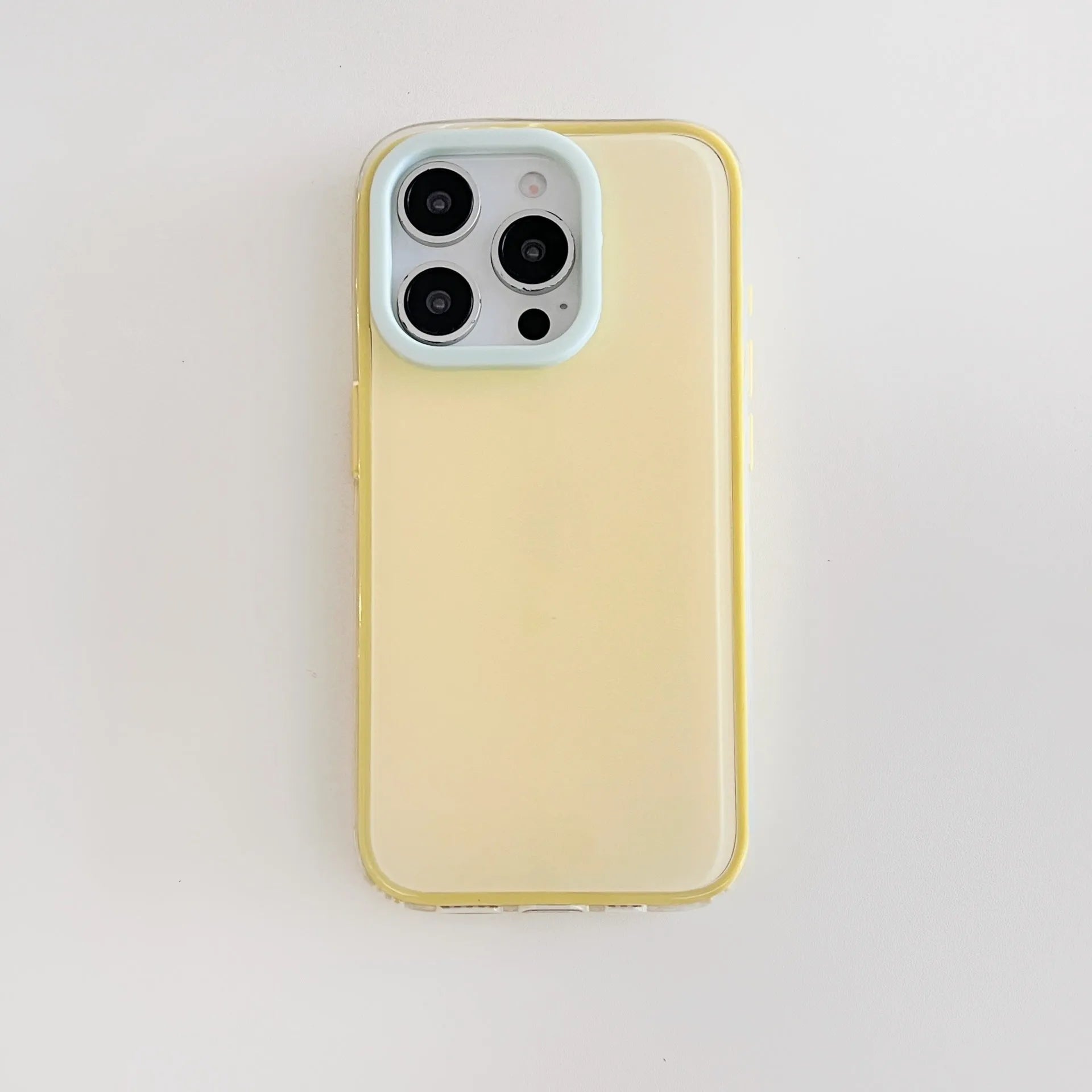 Simple solid colour jelly TPU phone case for iPhone, shown in blue, white, and yellow.